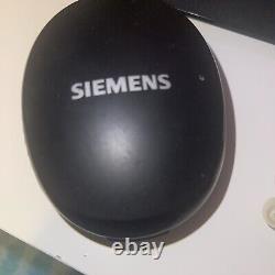 Siemens Pure Primax Hearing Aids with case behind ear