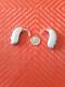 TWO PROGRAMMABLE HEARING AIDs program noise reduction choose mics WE PROGRAM